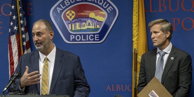 Ahmad Assed, president of the Islamic Center of New Mexico, left, speaks at a news conference to announce the arrest of Muhammad Syed. 