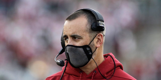 Washington State coach Nick Rolovich watches during the first half of an NCAA college football game against Stanford on Oct. 16, 2021, in Pullman, Wash. The former Washington State football coach has filed a claim against the university on April 27, 2022, seeking $25 million for wrongful termination after he was fired last year for refusing to get vaccinated against COVID-19. 