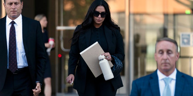 Vanessa Bryant, center, the widow of Kobe Bryant, leaves a federal courthouse in Los Angeles, Wednesday, Aug. 10, 2022.