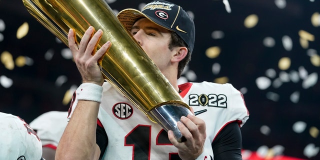 Georgia's Stetson Bennett celebrates after the College Football Playoff championship football game against Alabama, Tuesday, Jan. 11, 2022, in Indianapolis. Georgia's football season is set to begin on Sept. 3, 2022, against Oregon.