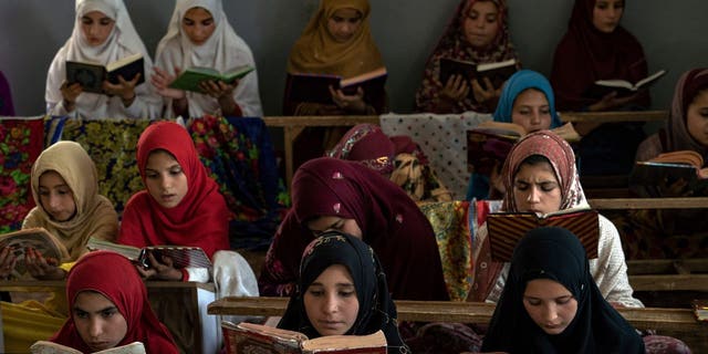 Afghan girls read the Koran at the Noor Mosque outside the city of Kabul, Afghanistan, Wednesday, Aug. 3, 2022. Maulvi Bakhtullah, the head of the mosque, said the number of girls who come to this mosque to learn the Koran has multiplied after the closure of public schools. 