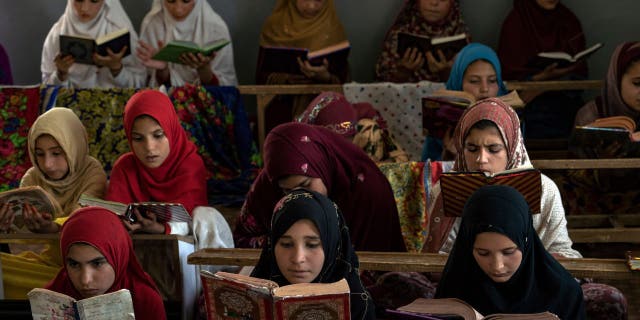 Afghan girls read the Koran at the Noor Mosque outside the city of Kabul, Afghanistan, Wednesday, Aug. 3, 2022. Maulvi Bakhtullah, the head of the mosque, said the number of girls who come to this mosque to learn the Koran has multiplied after the closure of public schools.
