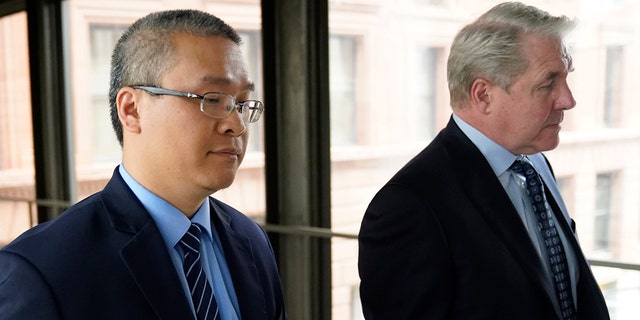 Former Minneapolis police officer Tou Thao, left, and his attorney Robert Paule arrive for sentencing for violating George Floyd's civil rights outside the Federal Courthouse Wednesday, July 27, 2022, in St. Paul, Minn. 