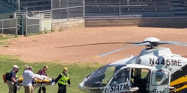 In this still image from video, author Salman Rushdie is taken on a stretcher to a helicopter for transport to a hospital after he was attacked during a lecture at the Chautauqua Institution in Chautauqua, N.Y., Friday, Aug. 12, 2022.