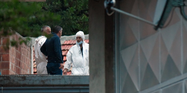 Police investigators work at the site of the attack in Cetinje, 36 kilometers (22 miles) west of Podogrica, Montenegro, Friday, Aug. 12, 2022. A man went on a shooting rampage in the streets of this western Montenegro city Friday, killing multiple people, before being shot dead by a passerby, officials said.