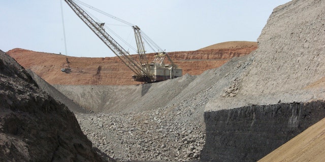 A dragline excavator moves rocks above a coal seam at the Spring Creek Mine in Decker, Mont. Coal has been one of the most widely used fossil fuels for centuries. 