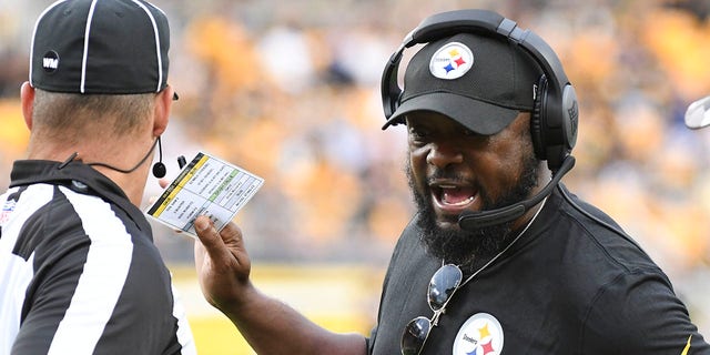 Pittsburgh Steelers head coach Mike Tomlin talks to an official during the first half of a preseason NFL game against the Seattle Seahawks in Pittsburgh on Saturday, Aug. 13, 2022.