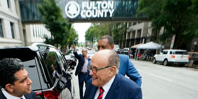 Rudy Giuliani arrives at the Fulton County Courthouse on Aug. 17, 2022, in Atlanta to testify before a special grand jury investigating former President Donald Trump's efforts to overturn the 2020 election results in Georgia.