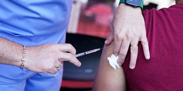 A nurse administers a monkeypox vaccine at a walk-in clinic at the North Jersey Community Research Initiative in Newark, N.J.