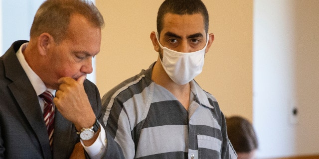Defense attorney Nathaniel Barone, left, and Hadi Matar, 24, right, listen during an arraignment in the Chautauqua County Courthouse in Mayville, New York.