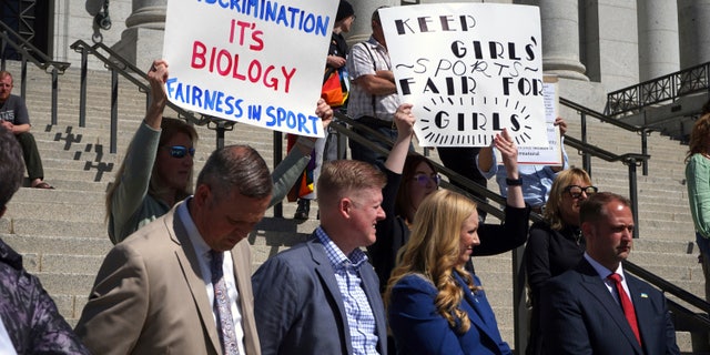 Lawmakers listen as parents speak about the prospect of their children competing against transgender girls in school sports at the Utah State Capitol.