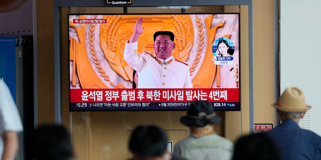 FILE - A TV screen showing a news program reporting about North Korea's missile launch with a file footage of North Korean leader Kim Jong Un, is seen at the Seoul Railway Station in Seoul, South Korea, Wednesday, Aug. 17, 2022.  (G3 Box News Photo/Lee Jin-man, File)
