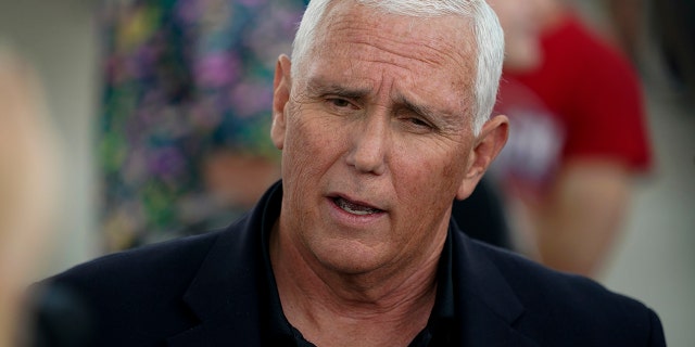 Former Vice President Mike Pence speaks to reporters during a visit to the Iowa State Fair, Friday, Aug. 19, 2022, in Des Moines, Iowa. 