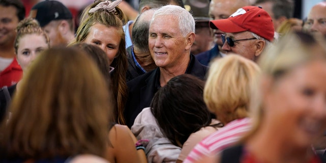 Former Vice President Mike Pence greets fair attendees during a visit to the Iowa State Fair in Des Moines, Iowa, Friday, August 19, 2022. 