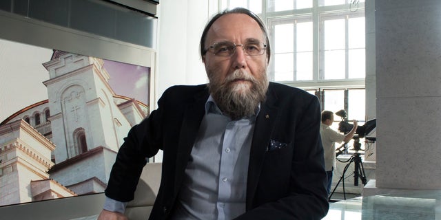 In this photo taken on Thursday 11 August 2016, Alexander Dugin, the neo-Eurasian ideologue, sits in his TV studio in central Moscow, Russia.  The daughter of this Russian nationalist ideologue who is often called "Putin's brain"was killed when her car exploded on the outskirts of Moscow, officials said on Sunday, Aug.21, 2022.