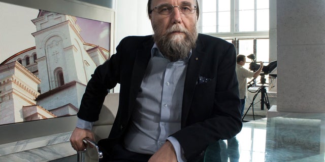 In this photo taken on Thursday, Aug. 11, 2016, Alexander Dugin, the neo-Eurasianist ideologue, sits in his TV studio in central Moscow, Russia. The daughter of this Russian nationalist ideologist who is often referred to as "Putin's brain", was killed when her car exploded on the outskirts of Moscow, officials said Sunday, Aug. 21, 2022.