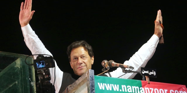 Former Pakistani Prime Minister Imran Khan waves to his supporters during an anti-government rally, in Lahore, Pakistan, April 21, 2022. (G3 Box News Photo/K.M. Chaudary, File)