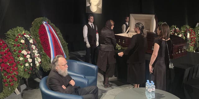 Philosopher Alexander Dugin, left, attends a farewell ceremony for his daughter Daria Dugina in Moscow, Russia.