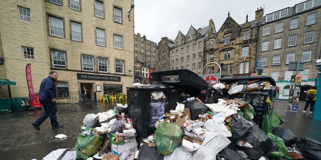 A view of overflowing rubbish bins in Edinburgh's Grassmarket area, where Edinburgh City Council cleaners are on the fourth of eleven days of strikes in Scotland, Wednesday 8th 24th, 2022.