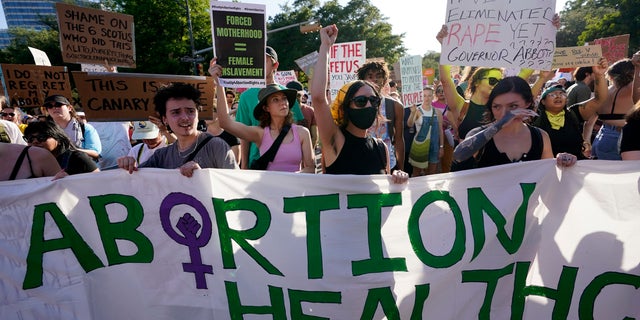 Demonstrators march and gather near the Texas State Capitol in Austin following the Supreme Court's decision to overturn the Roe v. Wade case on June 24, 2022.