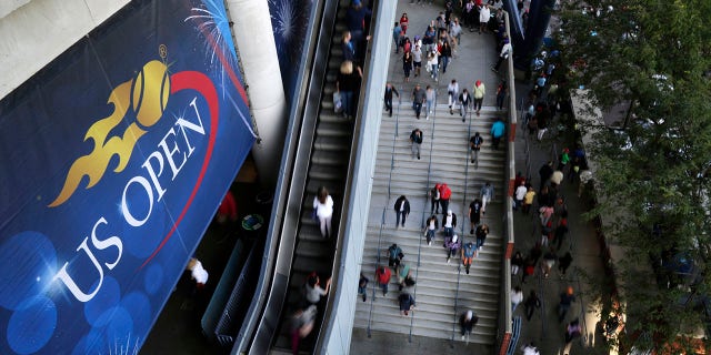 Tennis fans move in and out of Arthur Ashe Stadium during the fourth round of the U.S. Open tennis tournament in New York on Sept. 3, 2017.