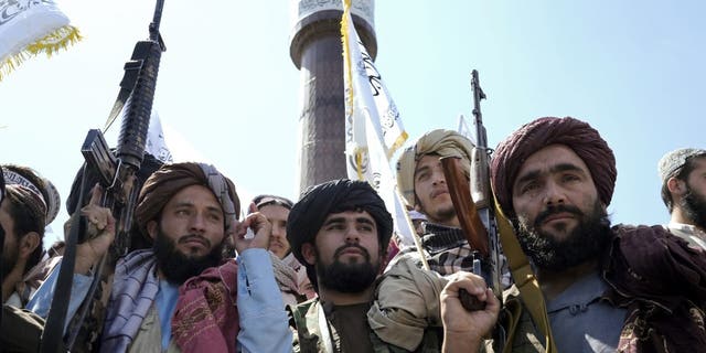 Taliban fighters celebrated the first anniversary of the withdrawal of US-led troops from Afghanistan, in front of the U.S. Embassy in Kabul, Afghanistan, Wednesday, Aug. 31, 2022. (AP Photo/Ebrahim Noroozi)