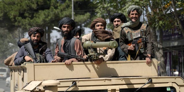 Taliban fighters celebrate the first anniversary of the withdrawal of US-led troops from Afghanistan, in Kabul, Afghanistan, Wednesday, Aug. 31, 2022. 