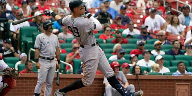 New York Yankees' Aaron Judge follows through on a two-run double during the fifth inning of a baseball game against the St. Louis Cardinals Sunday, Aug. 7, 2022, in St. Louis.