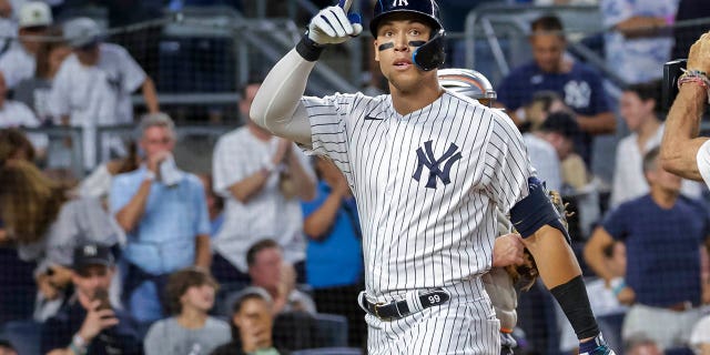 New York Yankees' Aaron Judge celebrates a home run in the third inning of a baseball game against the New York Mets, Monday, Aug. 22, 2022, in New York.