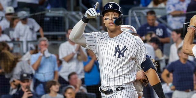 New York Yankees' Aaron Judge celebrates a home run in the third inning of a baseball game against the New York Mets, Monday, Aug. 22, 2022, in New York.