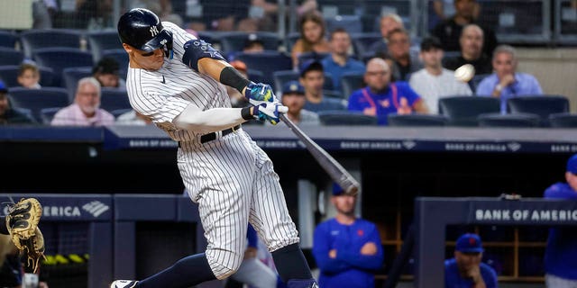 New York Yankees' Aaron Judge hits a home run in the third inning of a baseball game against the New York Mets, Monday, Aug. 22, 2022, in New York.