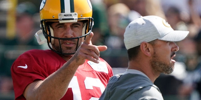 Green Bay Packers' Aaron Rodgers runs a drill before a joint practice session with the New Orleans Saints on Aug. 16, 2022, in Green Bay, Wisconsin.