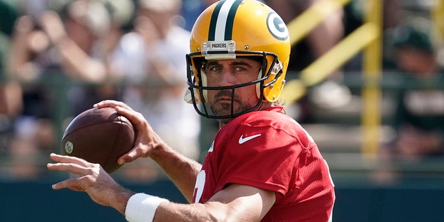 Green Bay Packers' Aaron Rodgers runs a drill before a joint practice session with the New Orleans Saints on Aug. 16, 2022, in Green Bay, Wisconsin.