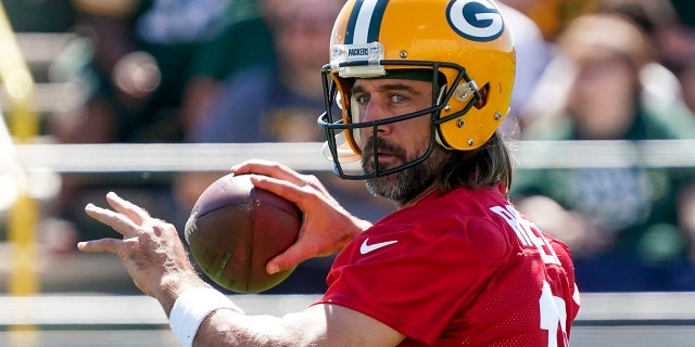 Green Bay Packers' Aaron Rodgers runs a drill at the NFL football team's practice field Saturday, July 30, 2022, in Green Bay, Wisconsin.