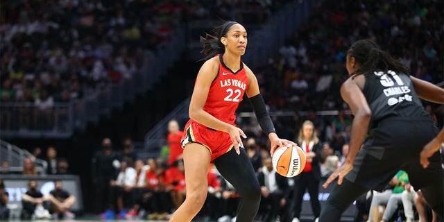 A'ja Wilson #22 of the Las Vegas Aces dribbles the ball during the game against the Seattle Storm on August 7, 2022 at the Climate Pledge Arena in Seattle, Washington. 