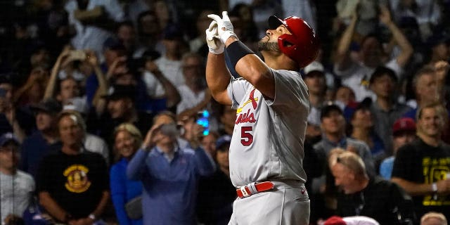 St. Louis Cardinals' Albert Pujols celebrates his 693rd career home run off Chicago Cubs starting pitcher Drew Smyly during the seventh inning of a baseball game Monday, Aug. 22, 2022, in Chicago.