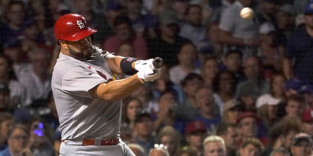 St. Louis Cardinals' Albert Pujols hits his 693rd career home run off Chicago Cubs starting pitcher Drew Smyly during the seventh inning of a baseball game Monday, Aug. 22, 2022, in Chicago.