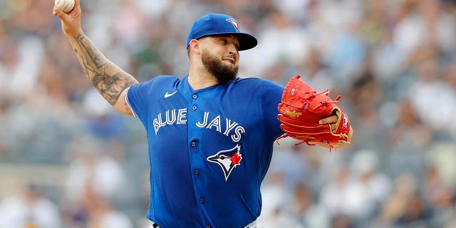 Alec Manoa of the Toronto Blue Jays pitches in the first round against the New York Yankees at Yankee Stadium in New York City on Aug. 21, 2022.