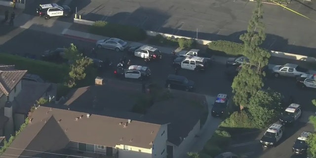 SWAT is in a standoff with a suspect after a shooting left a police officer and two others with injuries in Arcadia, California on Aug. 10, 2022. 