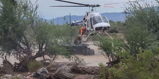 Rescuers said the 75-year-old man "is very lucky to be alive" after he drove into a wash on Friday and floodwaters flipped his vehicle over.