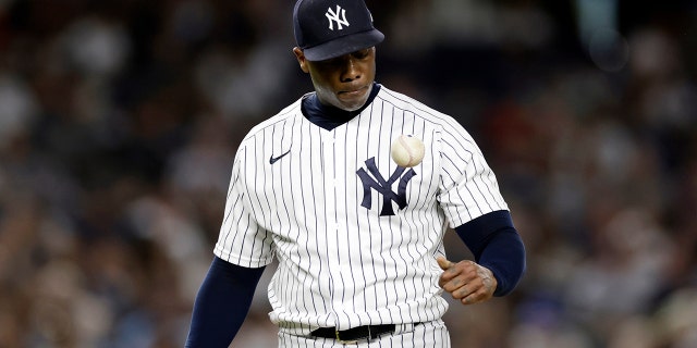 New York Yankees pitcher Aroldis Chapman reacts while he waits to be taken out during the ninth inning of a baseball game against the Toronto Blue Jays, Friday, Aug. 19, 2022, in New York.