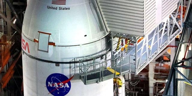 Artemis I and the Orion spacecraft shortly before rollout to the launch pad as seen from the high bay level inside the Vehicle Assembly Building at Kennedy Space Center, Florida, Launch Complex 39.