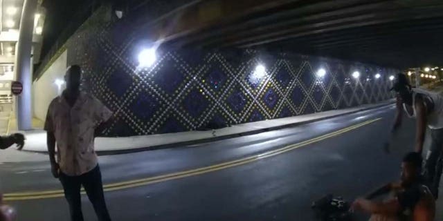 Body cam footage showing citizens detaining a man suspected of stealing car parts.