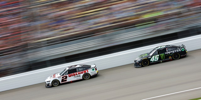 Kyle Busch and Austin Cindric involved in big crash in Michigan: 'I can't buy a break right now' 3 #2 Discount Tire Ford driver Austin Cindric and #45 Monster Energy Toyota driver Ty Gibbs race during the FireKeepers Casino 400 at Michigan International Speedway, Aug. 7, 2022, in Brooklyn, Michigan.