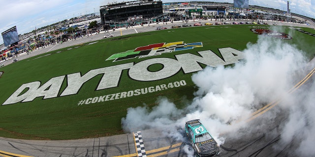 Austin Dillon, driver of the No. 3 Breztri Chevrolet, celebrates with a burnout after winning the Coke Zero Sugar 400 at Daytona International Speedway in Daytona Beach, Florida, on Aug. 28, 2022.