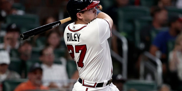 Austin Riley of Atlanta Braves hits a two-run homerun against the Los Angeles Angels in the fourth inning, Saturday, July 23, 2022, in Atlanta.