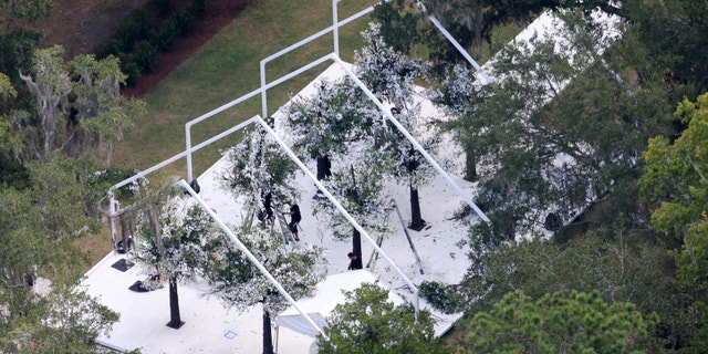 The marquee set up for Jennifer Lopez and Ben Affleck's ceremony is decorated with flowering trees near the water’s edge.