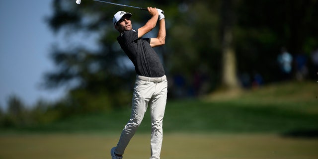 Joaquin Niemann, of Chile, hits on the 12th hole during the third round of the BMW Championship golf tournament at Wilmington Country Club, Saturday, Aug. 20, 2022, in Wilmington, Del.