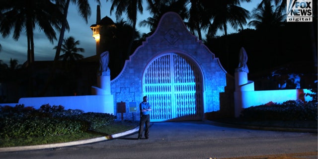 A security guard stands outside Mar-a-Lago in Palm Beach, Florida.