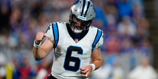 Carolina Panthers quarterback Baker Mayfield celebrates after throwing a touchdown pass against the Buffalo Bills during the first half of an NFL preseason football game on Friday, Aug. 26, 2022, in Charlotte, N.C. 